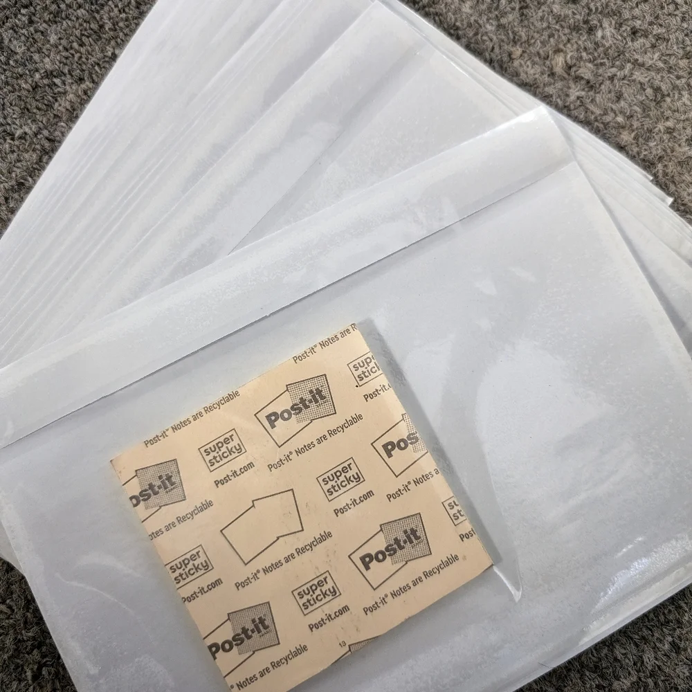 Stack of 20 sticking clear label pockets‎ for shipping labels